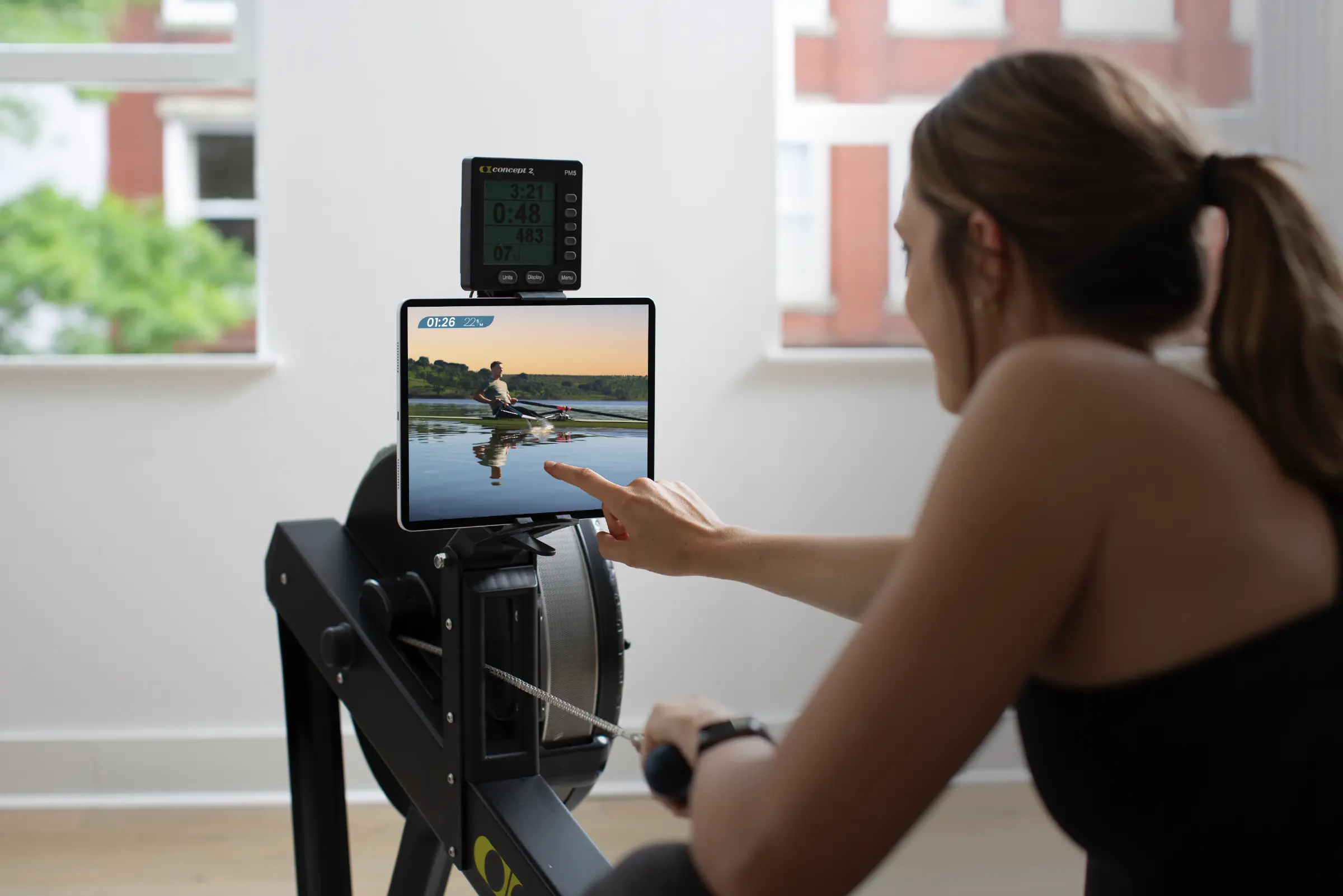 Row Like A Champion with Alex Gregory video playing on erg machine